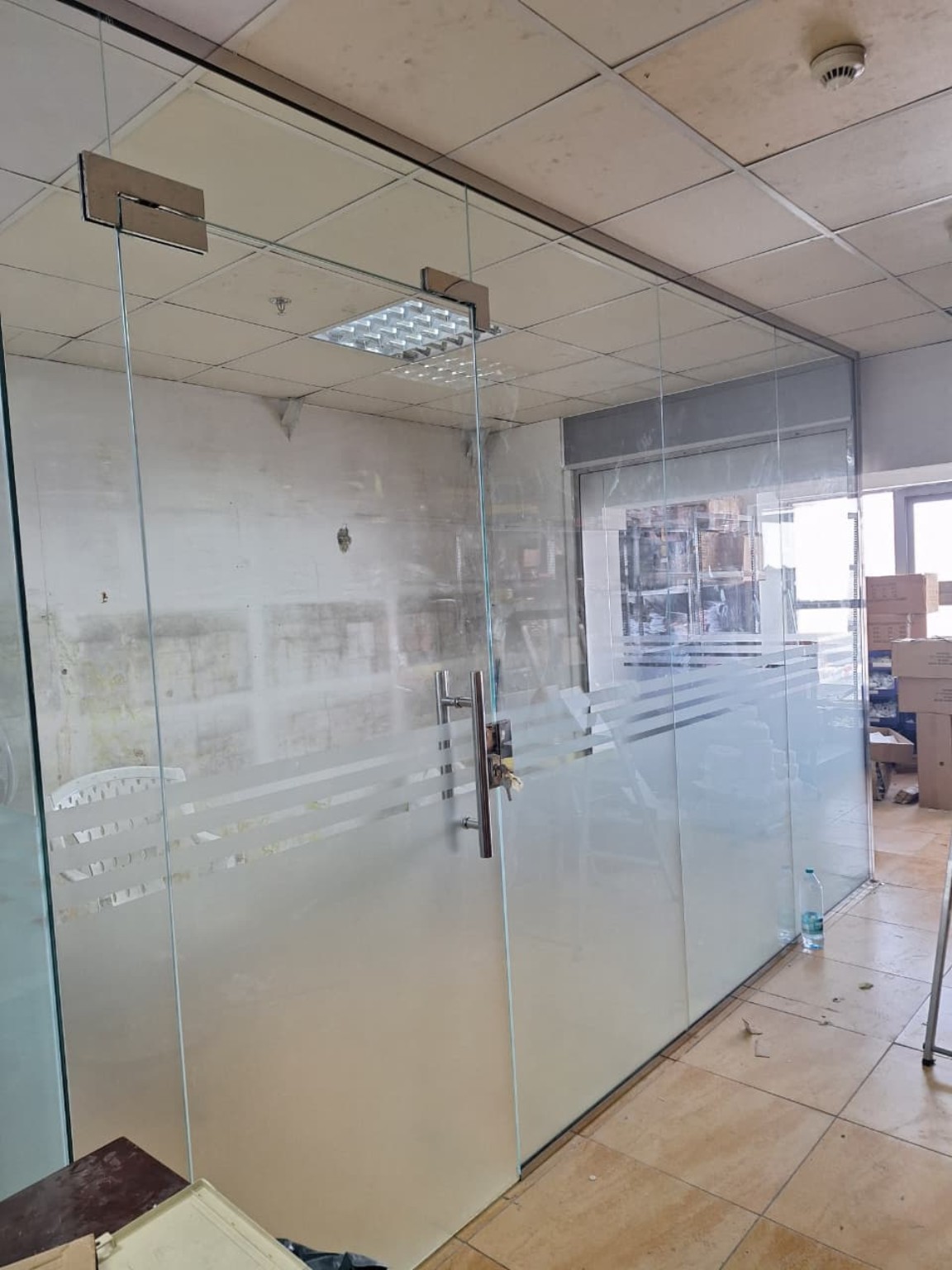 Frameless glass office room installation